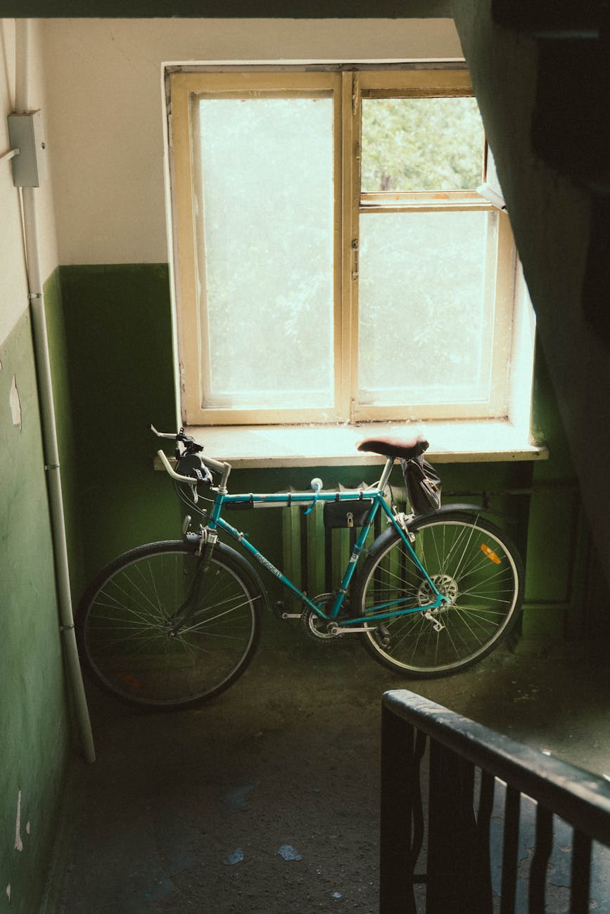 there s an old bicycle by the window in the entryway