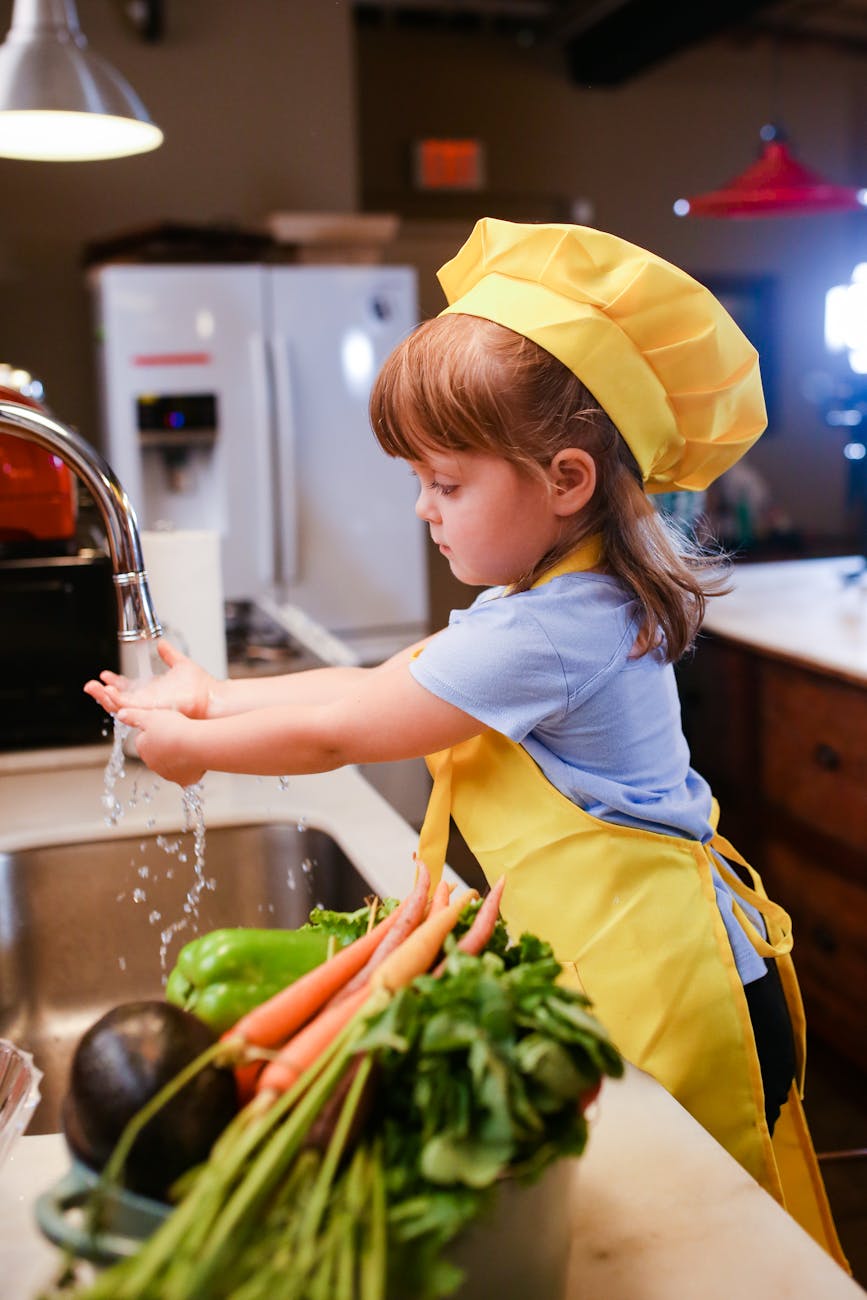 girl in white t shirt and yellow skirt in kitchen
