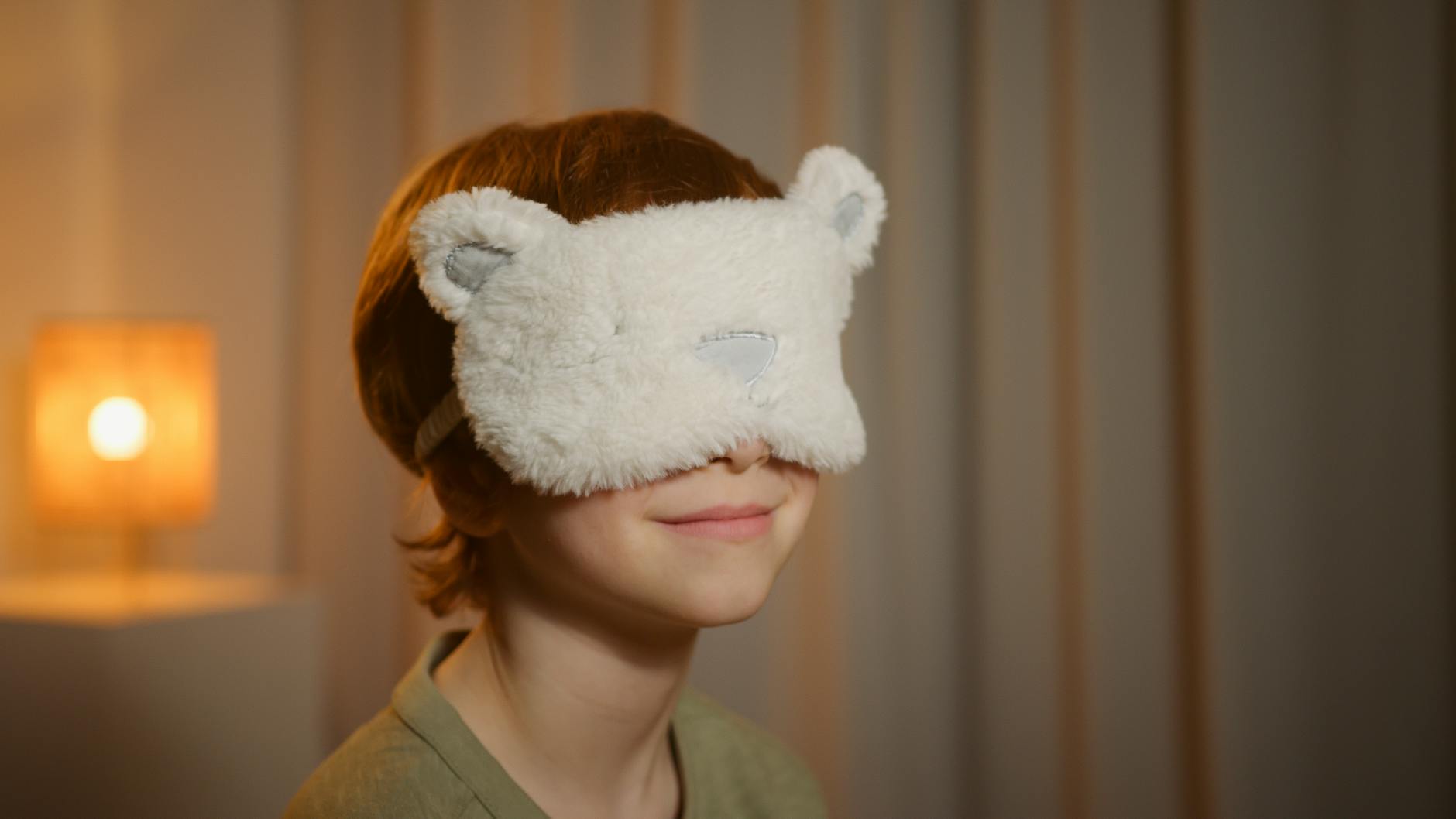 photograph of a boy with a sleep mask
