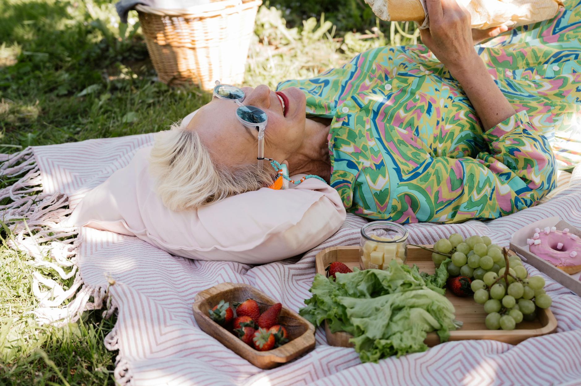 woman lying on a picnic blanket