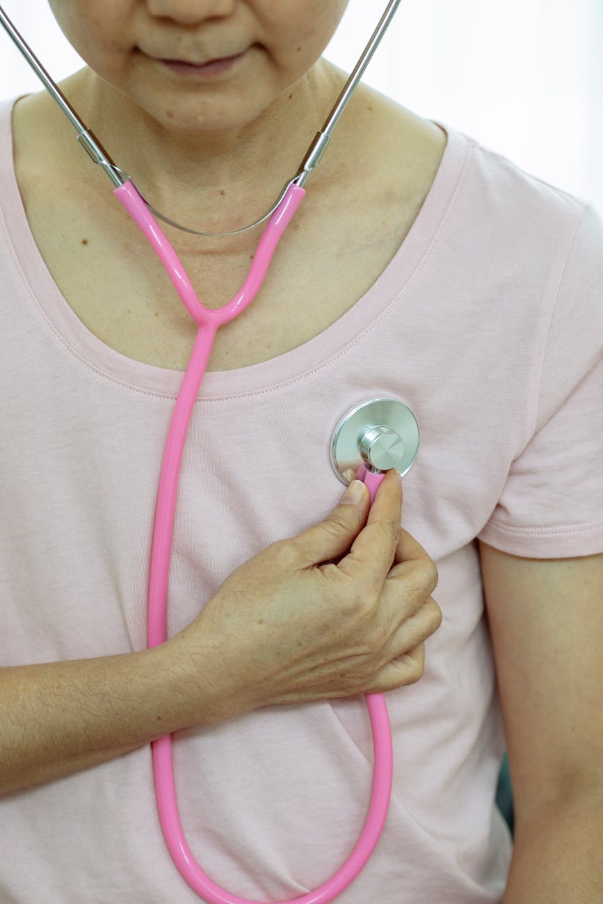faceless lady using stethoscope in room