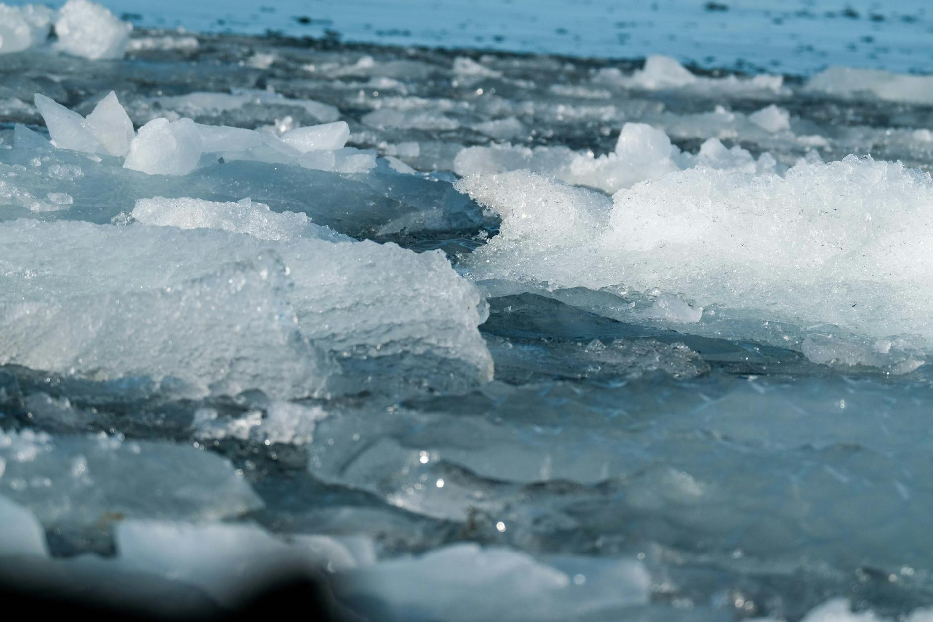 floating ice in cold blue waters close up view